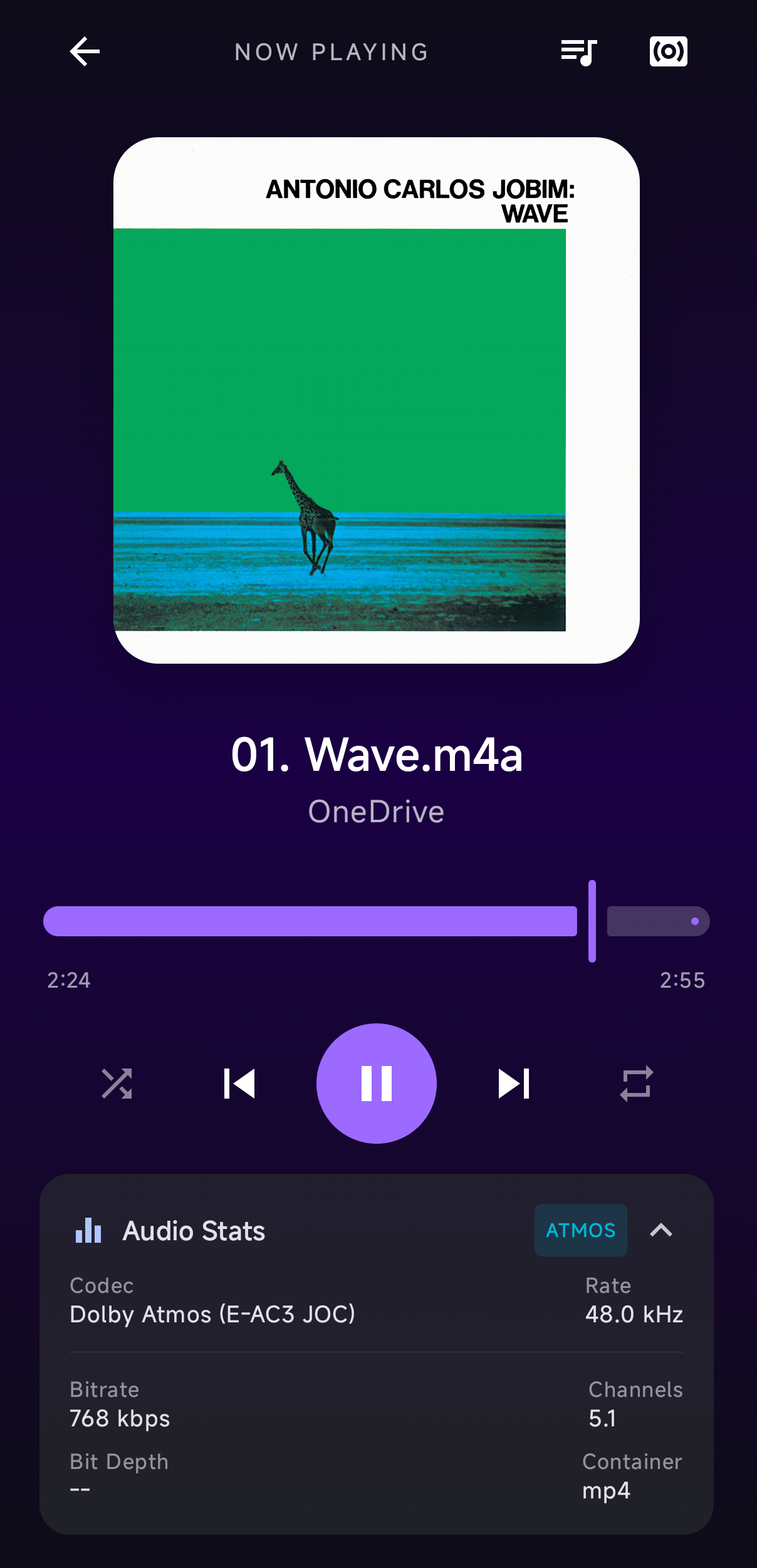 Reprodução no Woobify com capa de álbum e informação Dolby Atmos